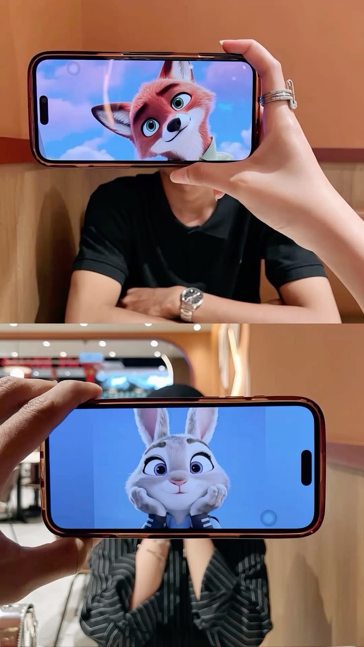 A couple holding animated character faces over their own