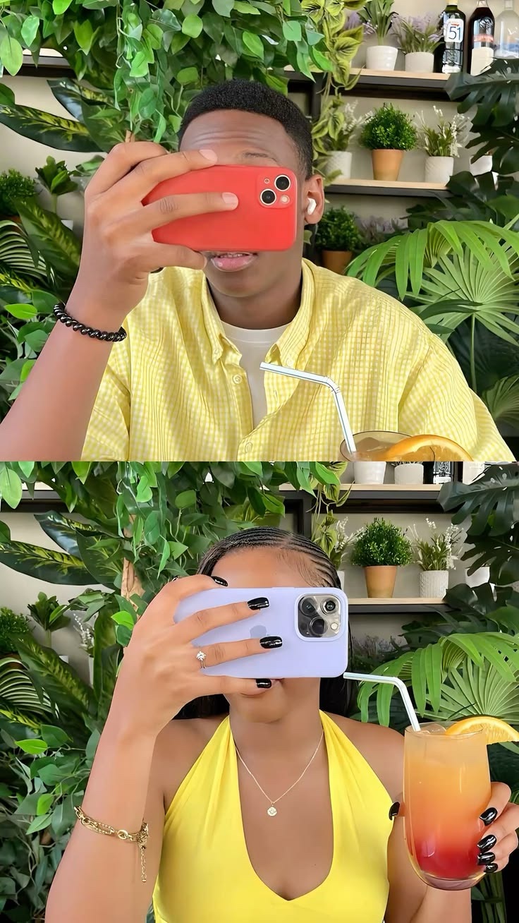 Two people hiding behind phones at a leafy restaurant