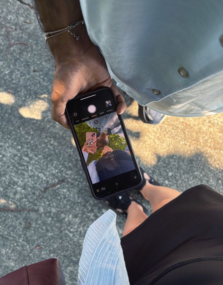 A phone camera photographing a partner from above
